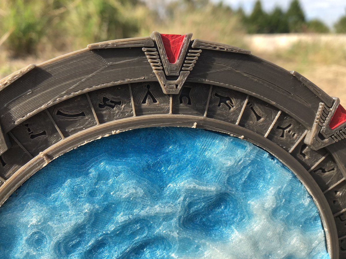 Stargate model found on thingiverse, printed in <a href="/AIORobotics/">AIO Robotics</a> dark grey on the CR-20S. Event horizon is printed in <a href="/Proto_pasta/">Protopasta</a> wonder blue and <a href="/3DSolutech/">3D Solutech</a> glow I the dark, blended on the A10M. Red chevrons are painted and might need a second coat. Now I just need a puddle jumper.