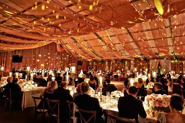 PartySlate's tweet photo. Rustic barn meets luxury hotel at this beautiful tented Chicago wedding. Pairing strung lights with projection mapping creates a dreamlike glow throughout your space. || Photographer: @kingensmith | Planner: @jaevents | Florals: @kehoedesigns || #PartySlate #PartySlatePro https://t.co/Z9uLJM9pXO