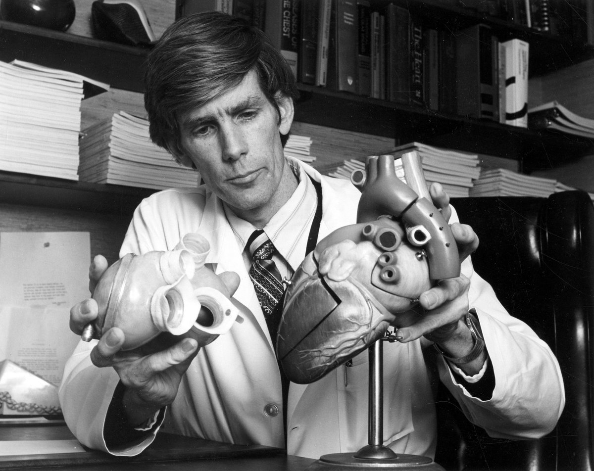 FredWuMD's tweet photo. The Jarvik-7 wasn’t the first artificial heart used in a human. In 1969, Denton Cooley had already implanted an artificial heart meant to provide temporary support, but in 1981, William DeVries of @UofUHealth received @US_FDA approval to implant a Jarvik-7 on a *permanent* basis. https://t.co/8KqQuOyv7D