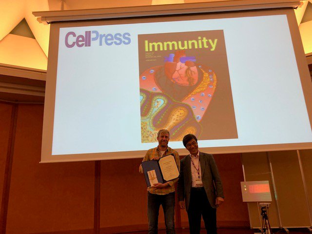 TrendsImmuno's tweet photo. @ImmunityCP provided two awards to researchers for their outstanding presentations at the #ILC2018 conference Dec 1st! Shown are award recipients Christoph Wilhelm @UniBonn and Yasutaka Motomura @RIKEN_IMS, awarded by Shigeo Koyasu, meeting co-organizer. https://t.co/YOch6OkB65