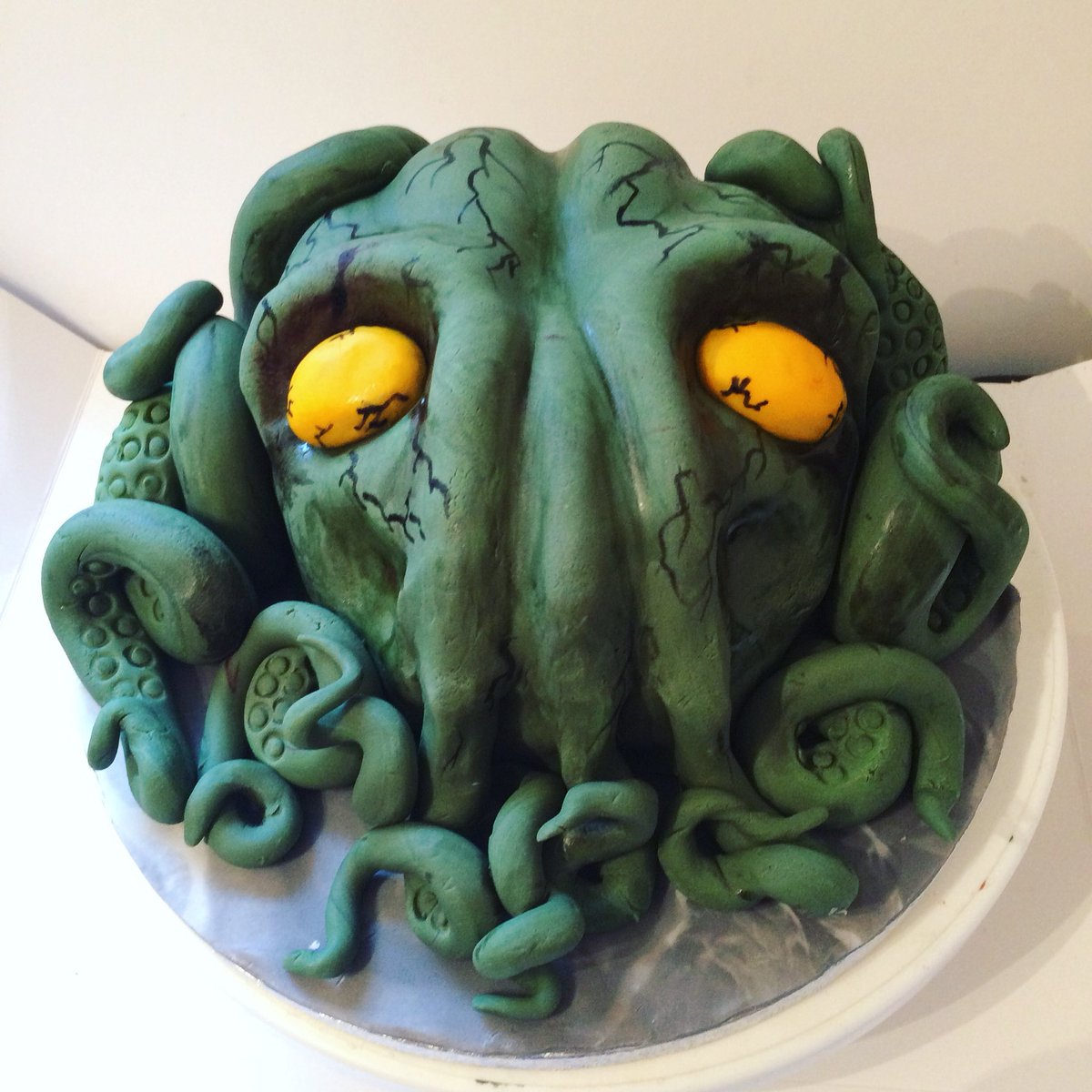 MissyBakes's tweet photo. A Chthulu Birthday cake this week, one of my favourites and “one of the best gluten free chocolate cakes they have had”  amazing feed back and wonderful customer ☺️ I really enjoyed making this one 😋😋😋. - - -  #chuthulu  #tentacle #tentacles #birthday #necronomicon #caketweet https://t.co/Ny8YQElmwq