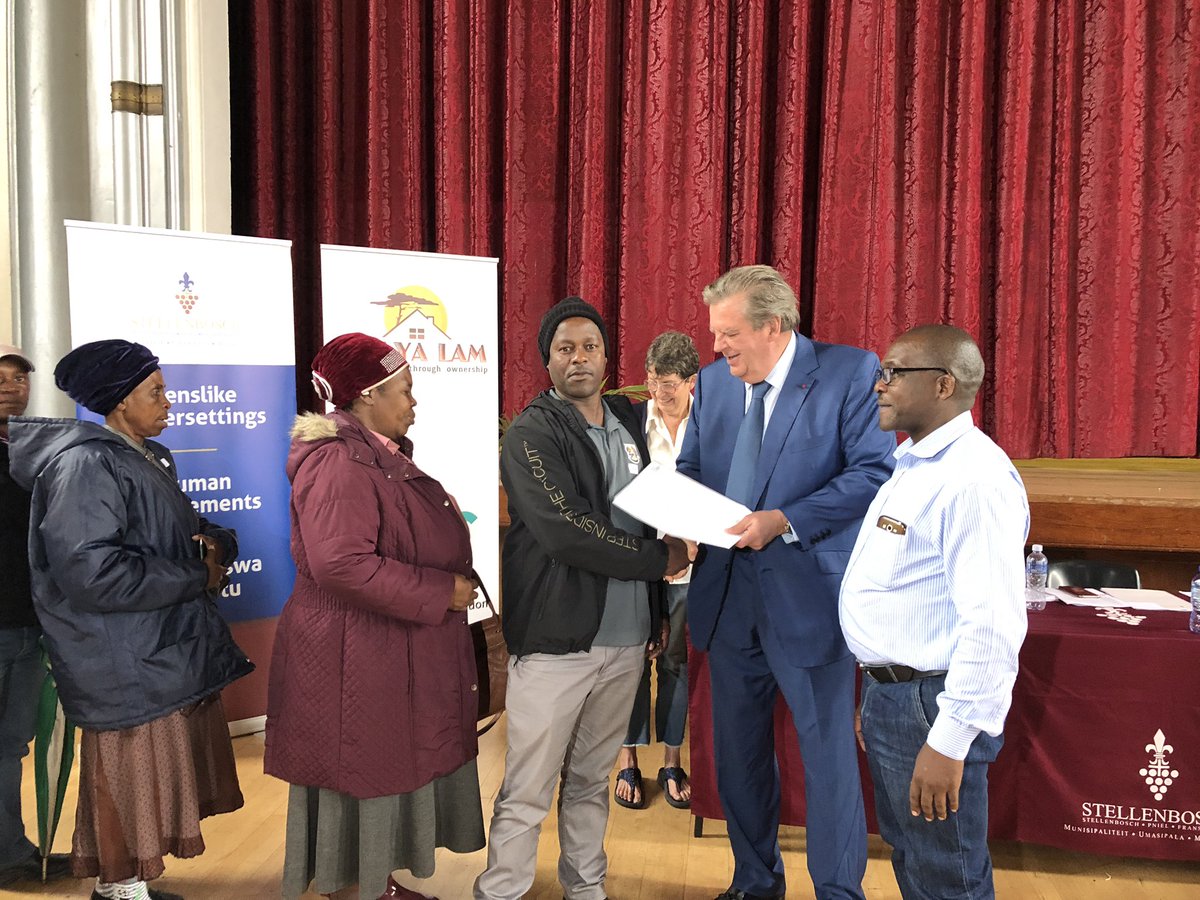 Dr. Johann Rupert handing over 326 title deeds to #Stellenbosch residents, who never owned the houses they resided in for years. <a href="/cutmaker/">Cutmaker</a> and his wife, Gaynor, will sponsor 10 000 title deeds to South Africans. <a href="/landbou/">landbou.com</a>