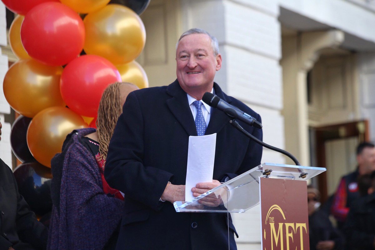 The Mayor standing at a podium delivering remarks at the Met Philadelphia grand opening.