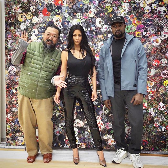 Kim Kardashian poses with Kanye West and artist Takashi Murakami