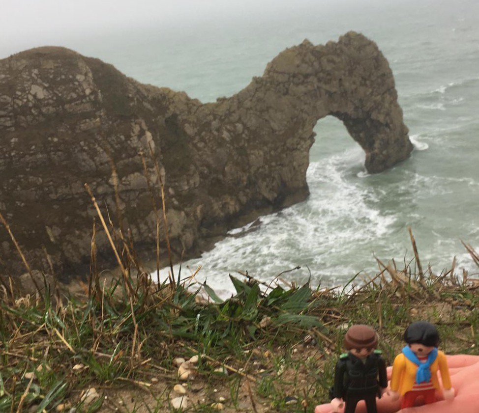 _Maybe_Zara's tweet photo. Yippee! Durdle Door! We learnt about the other side of geography this weekend, and luckily didn't get blown off the cliff edge despite the exhilarating stormy weather. #geographynerds #PerditaandMaybeZara https://t.co/T8hpXggGa8