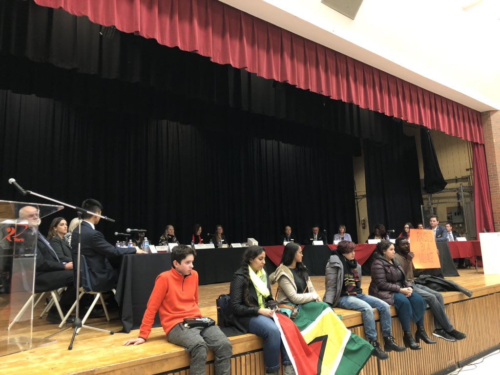 HaweyaF's tweet photo. Demonstrators remain on stage while the school board, including the newly-elected trustees, holds a special meeting to hear concerns from community members. https://t.co/pbdOqKwPSl