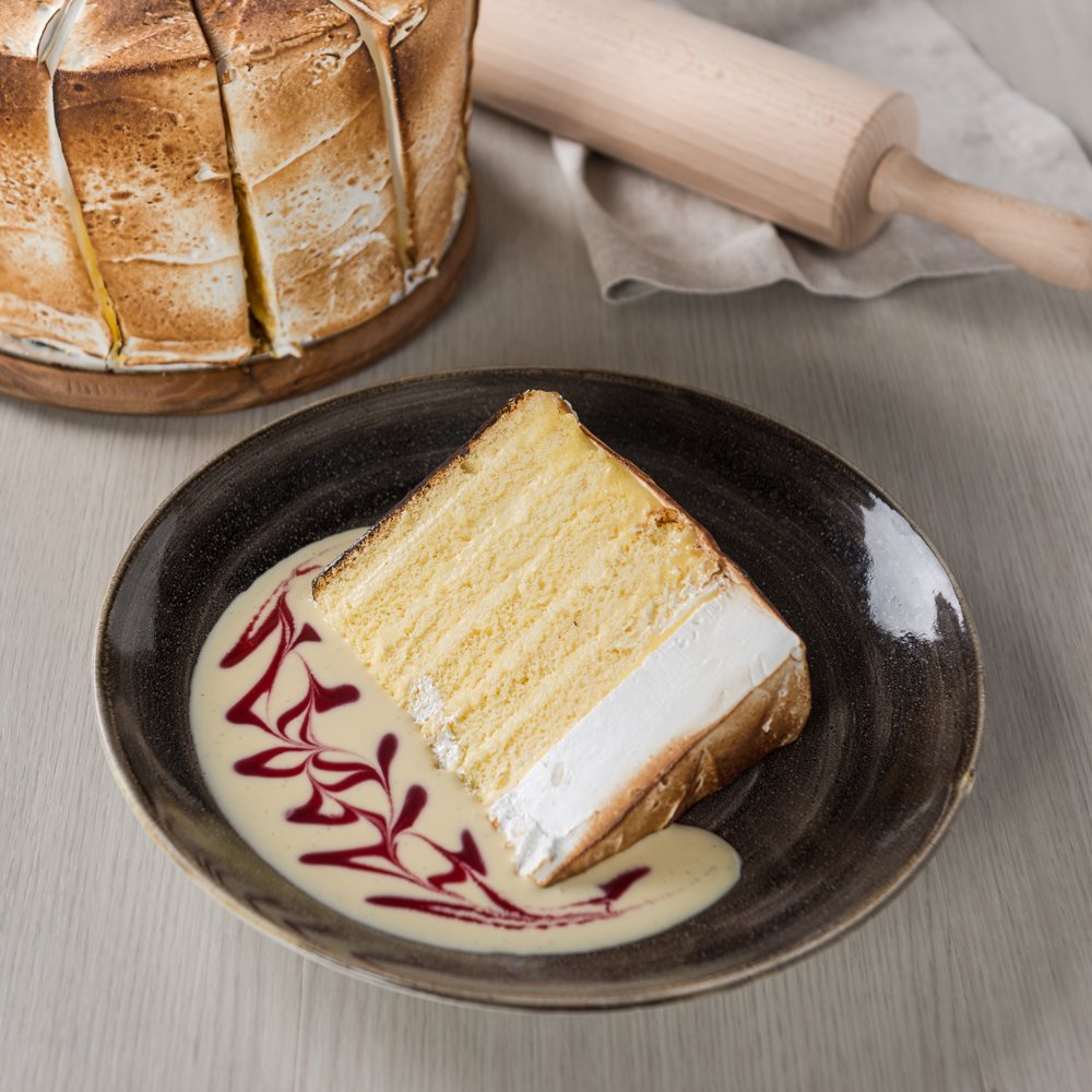 Lemon Meringue Layer Cake incorporates zesty lemon sponge cake layered with lemon curd and Swiss meringue. The moist, fluffy texture blends in with tangy lemon into a delicious mix of sweet and fresh sensation.
