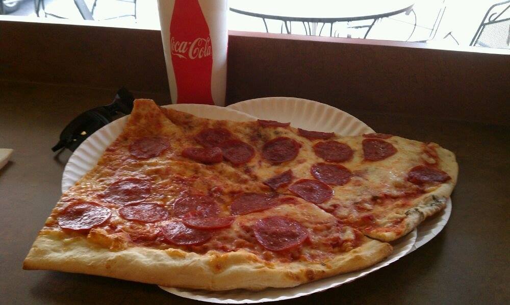 Two slices and a soda only $7.25 #YesPlease #largestsliceinthetriangle