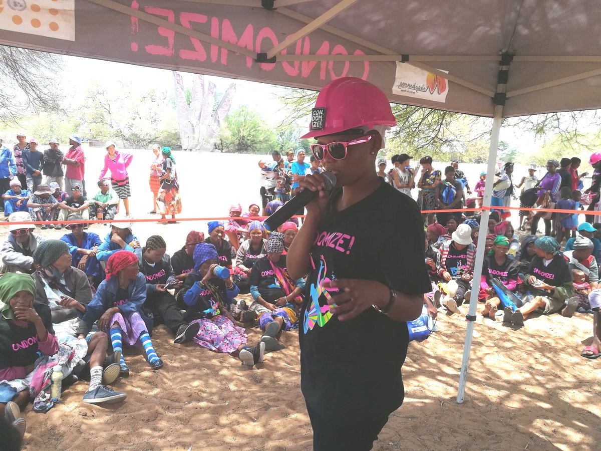 UNFPABotswana's tweet photo. Maria, 22, a passionate youth volunteer with the #CondomizeCampaign translating the Condomize message to Sesarwa, the local language in Dekar village. Ensuring that all in Dekar receive and understand all the information shared. https://t.co/EKAvg6K7GT