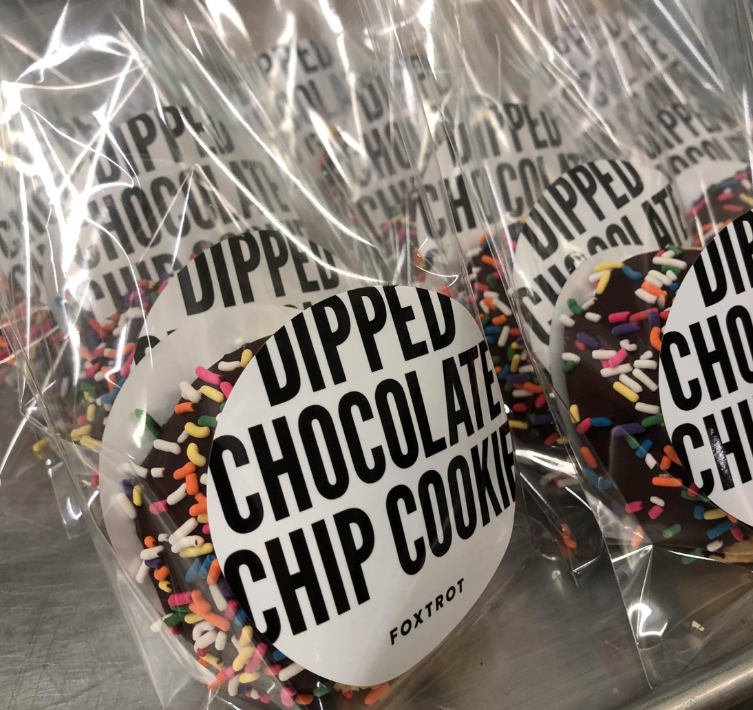 PaulWayneFood's tweet photo. What happens when we collab with #Foxtrot? Magic! This exclusive Dipped Chocolate Chip Cookie is ONLY available at Foxtrot Markets in Chicago! White and dark chips in this masterpiece, finished off with Belgian dark chocolate and topped it with sprinkles! Pick yours up today! https://t.co/pDF3M4SgJm