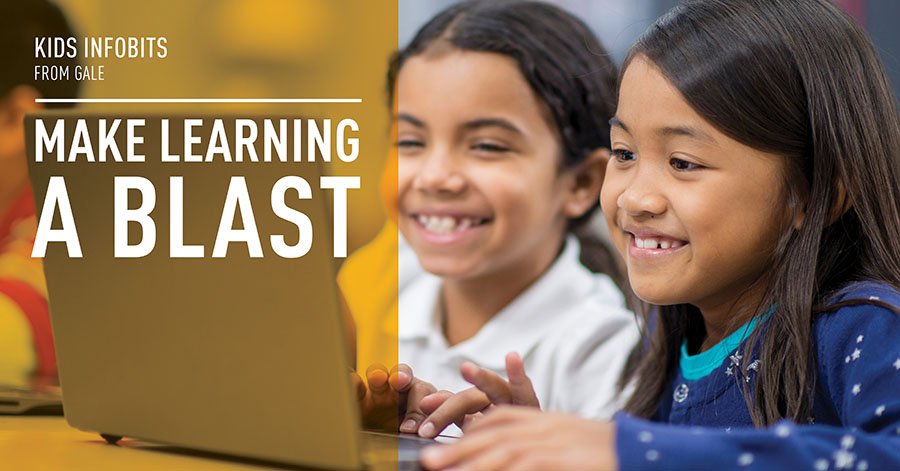 children smiling together looking at a computer. two little girls