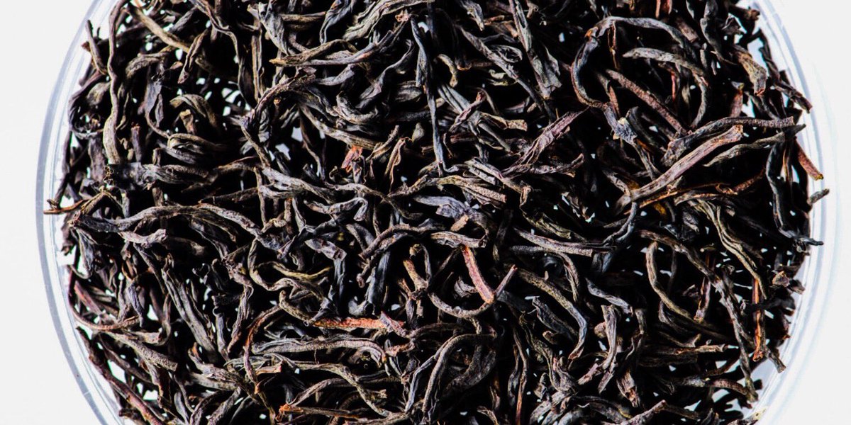 The inky black, rolled Pekoe leaf, with shotty appearance evolves into a coppery, dark infusion when infused. The mahogany colour and thick aroma suggest a full bodied tea and indeed presents a surprisingly powerful, yet restrained tea with an earthy character. #blacktea