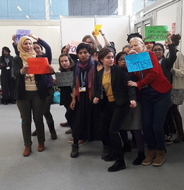 NoRob19's tweet photo. #Feminist #action at #COP24 by the Women &amp; Gender Constituency. They sang and danced to show that Feminists say NO to the global rise of macho-fascism! @CliMates_intl @WGC_Climate #ClimateJustice #FeministDemands #WomenDefendCommons https://t.co/99qyQlp6S6