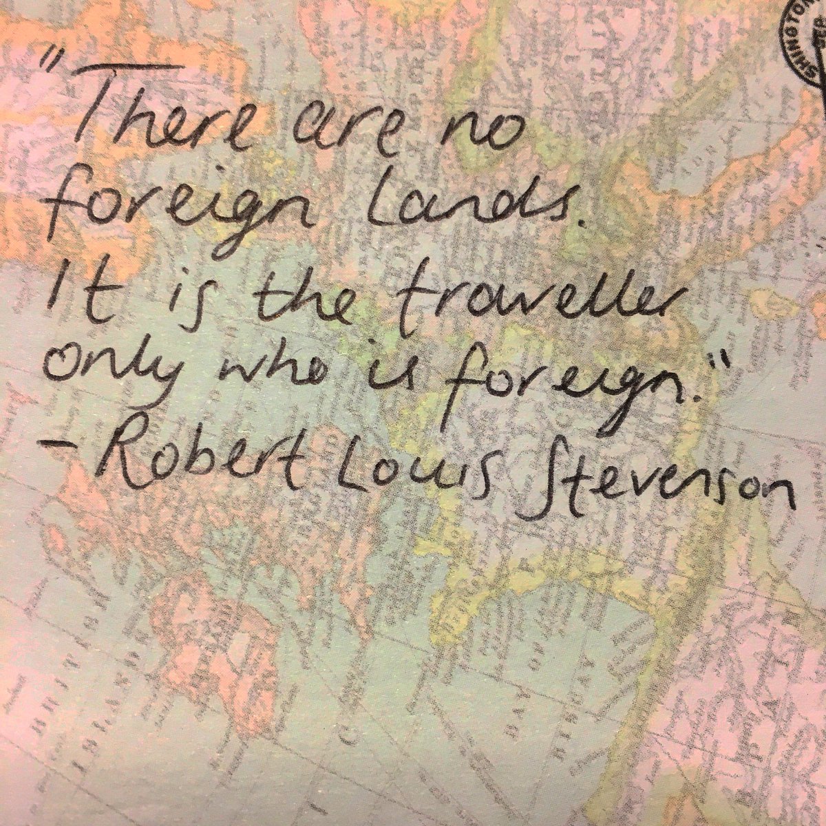 Quote written on map background reads ‘There are no foreign lands. It is the traveller only who is foreign.’ By Robert Louis Stevenson