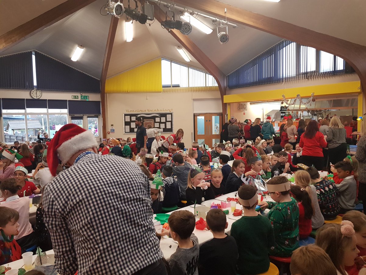 StaffytheDragon's tweet photo. Year 3 and 4 enjoying Christmas dinner @stafford_leys Mr Kitchen is playing all the Christmas hits and singing along!!! #singinglessonsneeded https://t.co/isXfUsKiP1