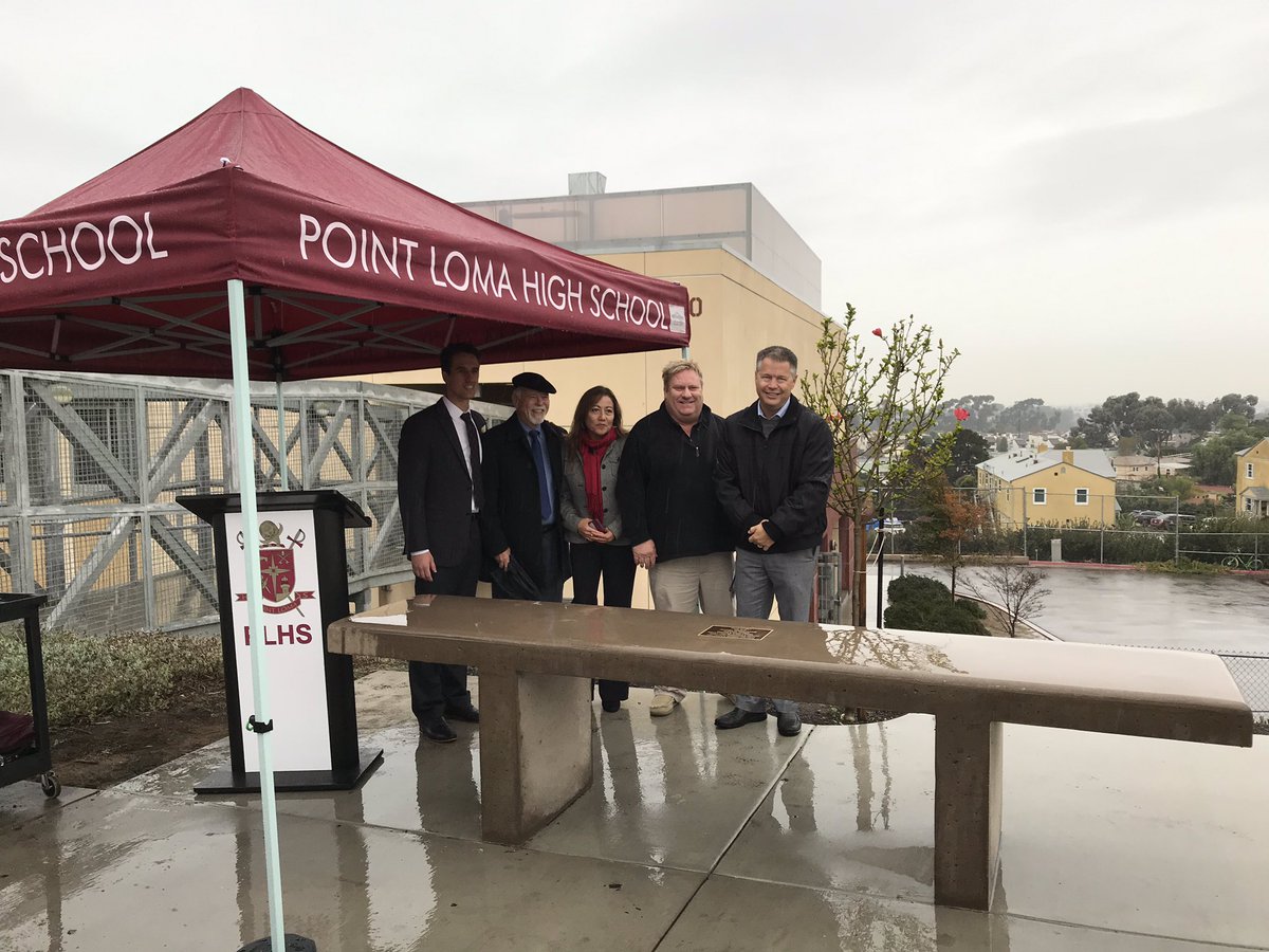 ptlomahs's tweet photo. Even a damp day couldn’t stop friends from coming out to dedicate our campus memorial to our beloved Kevin Gormly. His bench overlooks the ocean and our football field, two places he loved. #lovesdschools #Pointerway https://t.co/KswKeKQsp7