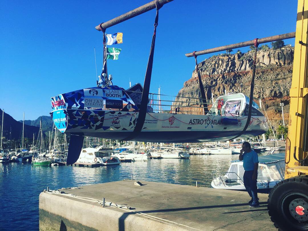 astrotoatlantic's tweet photo. Huntress is in the water!💙She is looking fab in the La Gomera sunshine - can’t wait to get out training. Thanks OHJAY Creative &amp; Future Client for all your superb graphics😍It’s been 18 months of prep to get here - thank you to our amazing sponsors for being part of our journey. https://t.co/Qo5Xqjr09e