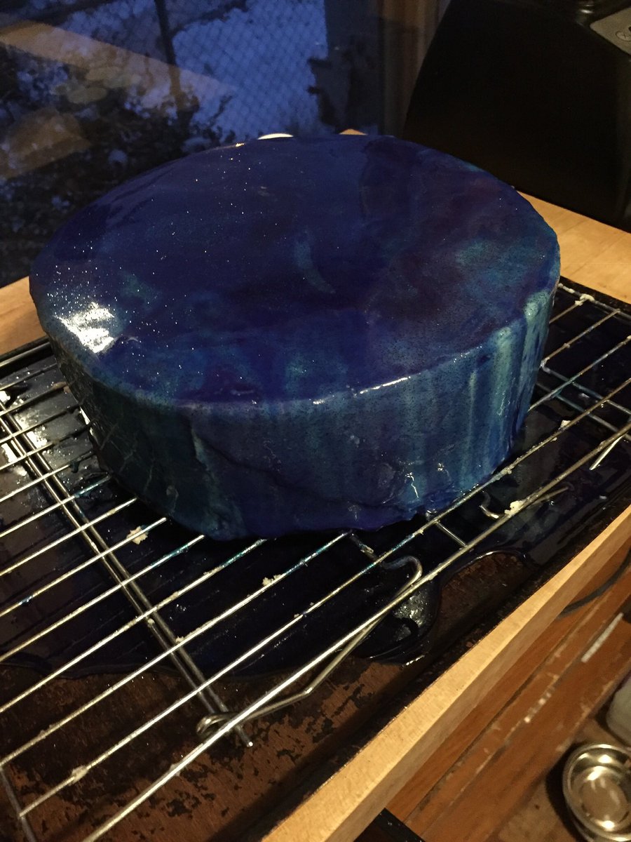This cake has a mirror glaze and glitter to create a galaxy cake. #yummy #baking
