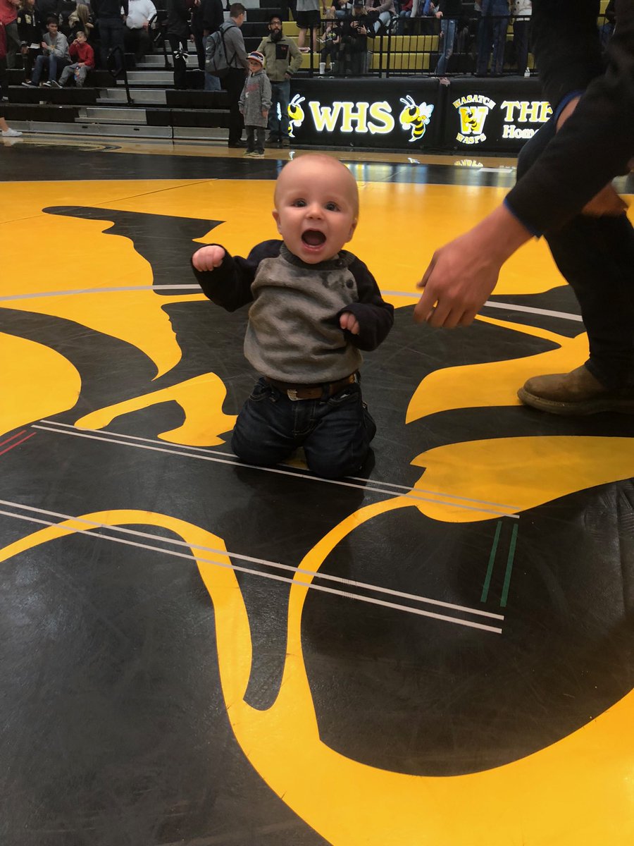 wasatch01's tweet photo. Meet my grandson Vince.  This little stud already loves wrestling @ 6 months old and was pretty happy with a big Wasatch win over Olympus tonight. Keep your eye on this one. He’ll be in a black &amp; gold singlet soon. Great job wasp wrestlers!#wasatchwrestling #nextgen https://t.co/tLGsGZKNo0