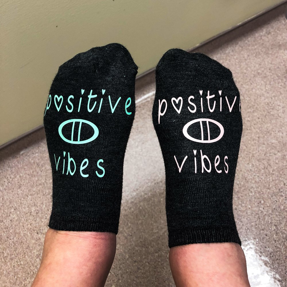 RADFertility's tweet photo. One of our patients wore these awesome socks on retrieval day! She was inspired to purchase her socks after seeing so many encouraging sock selfies from all of our patients! Her socks say it best and we are sending so many RAD positive vibes her way!❤️ #IVFGotThis #IVFSocks https://t.co/TdswtZbb6Y