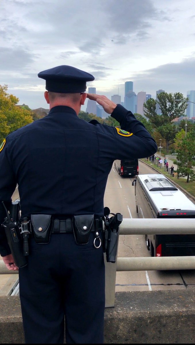 self24's tweet photo. As I was watching George HW Bush Final Journey from #Houston ... the police officer saluted, so I stepped back and made sure I got it ... #bush41 https://t.co/ZIjAbDR082