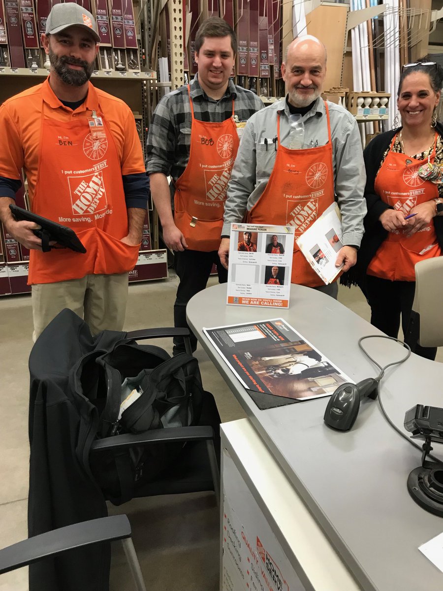 East Syracuse flooring team with Measure tech Ben Merkley and new tech sheet with QR code in plastic display on desk