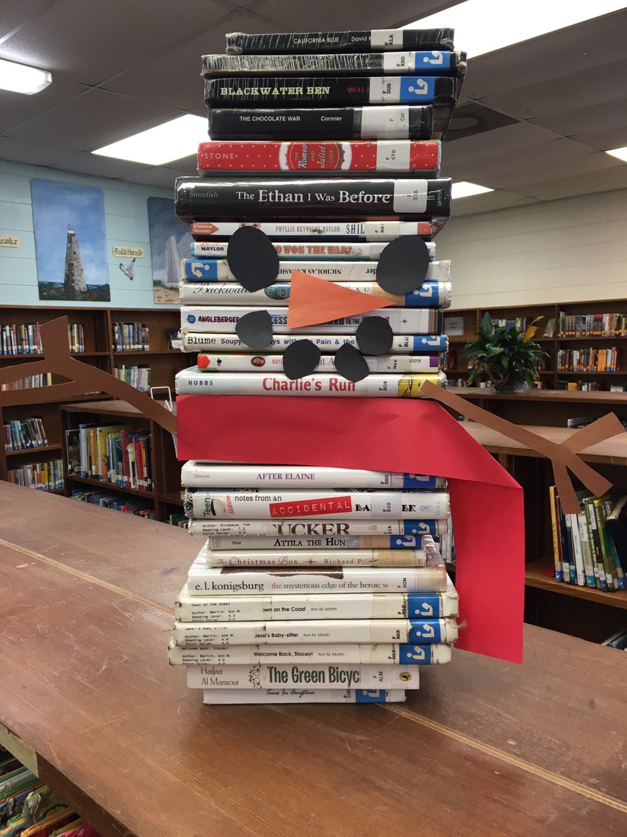HolbrookLMC's tweet photo. Fabulous #bookstack by one of our wonderful media assistants. Let it snow! #gastonlibrarylife https://t.co/kzQtxWL8vg
