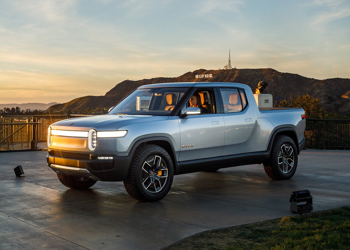 Rivian's tweet photo. #TBT to the moment Lindsey, our director of program management, rolled up to our reveal at the iconic @GriffithObserv in the #R1T, the world’s first Electric Adventure Vehicle. https://t.co/BLi0Auh03S