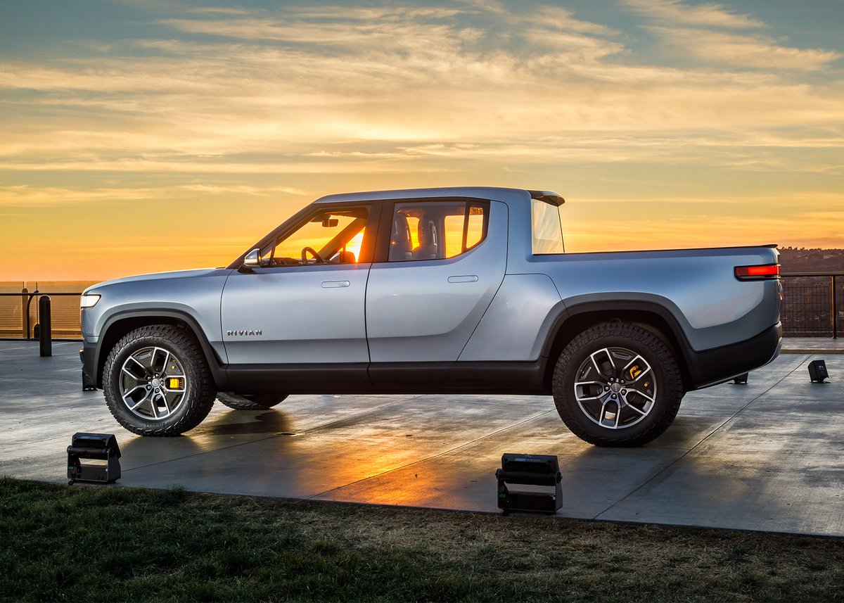 Rivian's tweet photo. #TBT to the moment Lindsey, our director of program management, rolled up to our reveal at the iconic @GriffithObserv in the #R1T, the world’s first Electric Adventure Vehicle. https://t.co/BLi0Auh03S