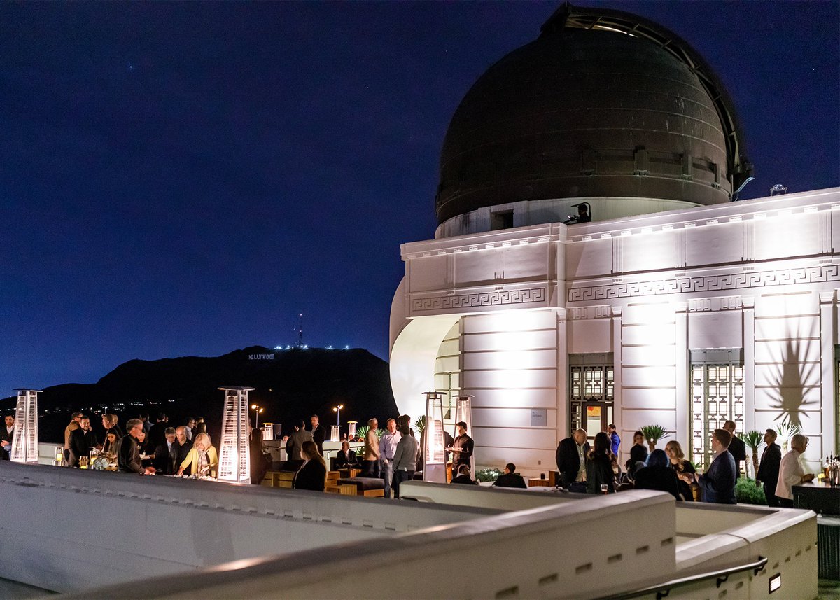 Rivian's tweet photo. #TBT to the moment Lindsey, our director of program management, rolled up to our reveal at the iconic @GriffithObserv in the #R1T, the world’s first Electric Adventure Vehicle. https://t.co/BLi0Auh03S