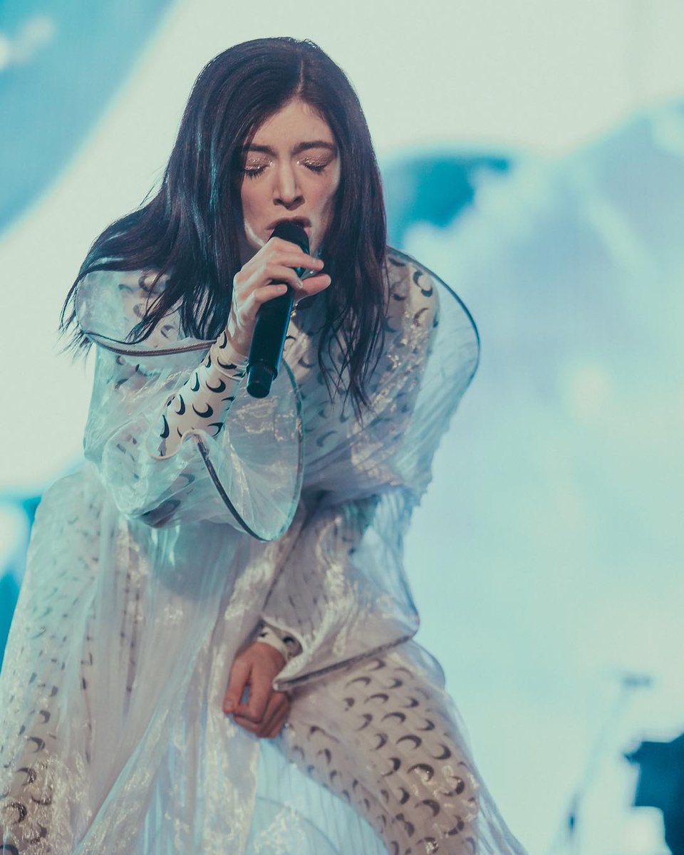 Lorde at Corona Capital fest, Mexico City. Outfit: SS19 collection pleated  translucent dress by @SidNeigum over Marine Serre moons. Styling for tour:  @karla_welch [ Rafa Montiel; Andrea Gonar; Lau Villegas]