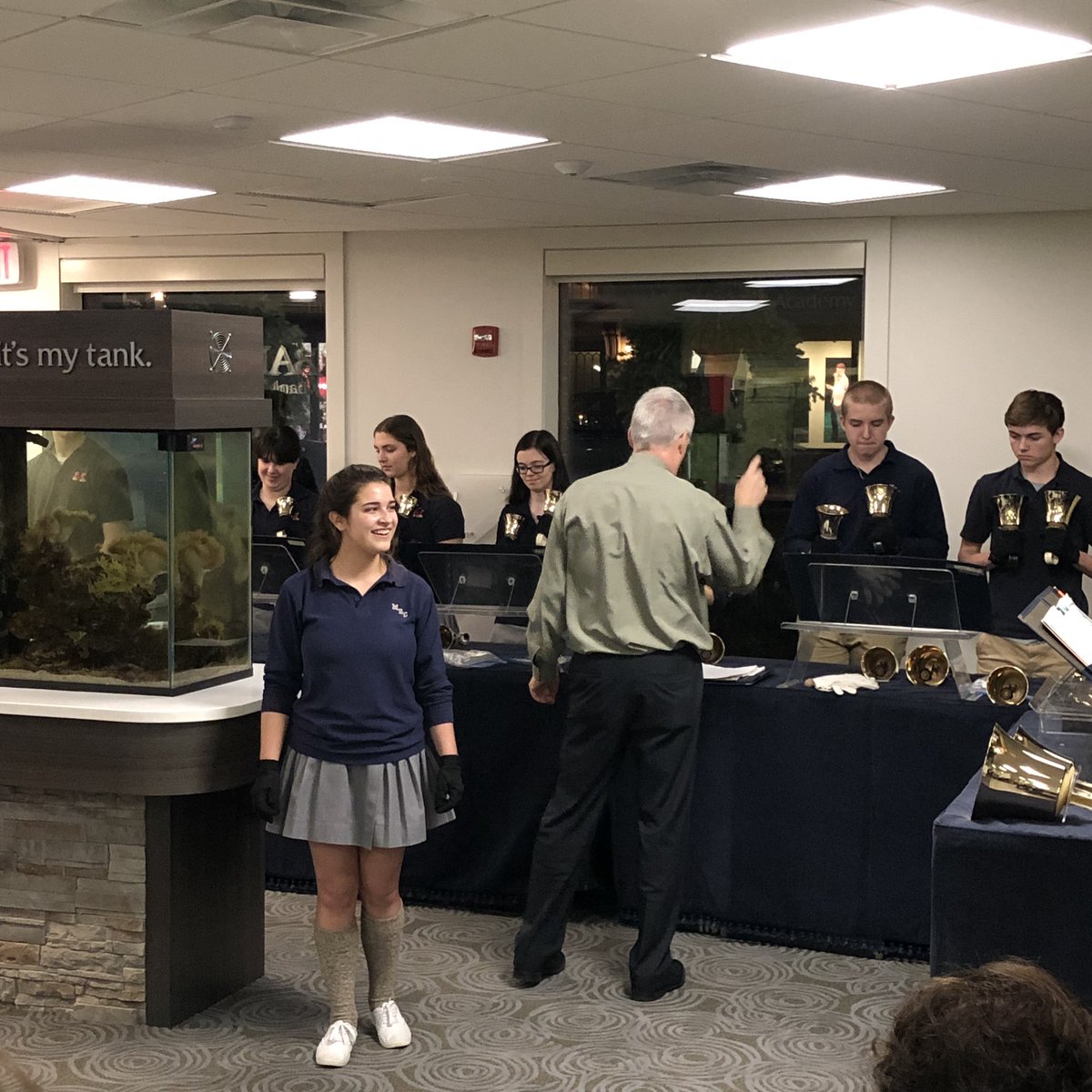 KevinG_DeanBank's tweet photo. Mount St Charles Academy Excelsior Hand Bell Choir performing at Dean Bank for 10th anniversary FDP Holiday Happenings @MtStCharles https://t.co/zF4YQyau4O
