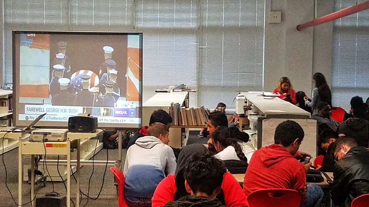 BaldLibrarian's tweet photo. Waltrip students paying last respects to President Bush in the library as they watch the ceremony at his train. #bush41 #Remembering41 #ramnation #waltriphighschool #baldlibrarian #librariesofinstagram #librariesofIG #ramnation #rambrary https://t.co/rg2T8UcyDi