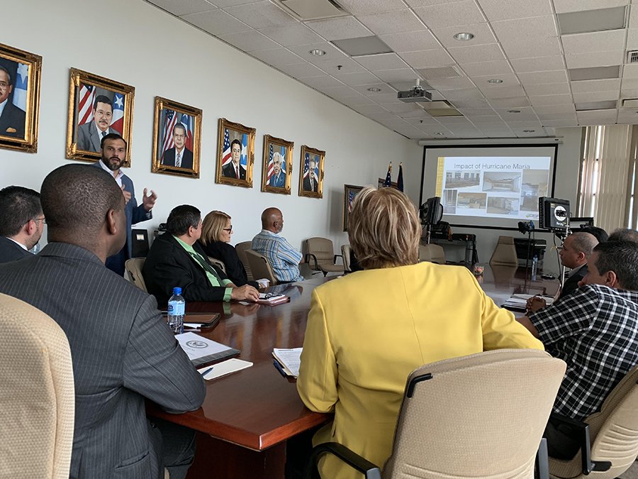 EACgov's tweet photo. @EACgov Chair Thomas Hicks (@RedBlue2024) listening to a presentation at the #PuertoRico State Elections Commission about the island’s recovery following #HurricaneMaria and the importance of federal collaboration.
#Countdown18 https://t.co/pmlY8vLj7O