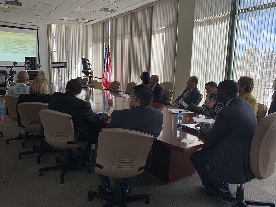 EACgov's tweet photo. @EACgov Chair Thomas Hicks (@RedBlue2024) listening to a presentation at the #PuertoRico State Elections Commission about the island’s recovery following #HurricaneMaria and the importance of federal collaboration.
#Countdown18 https://t.co/pmlY8vLj7O