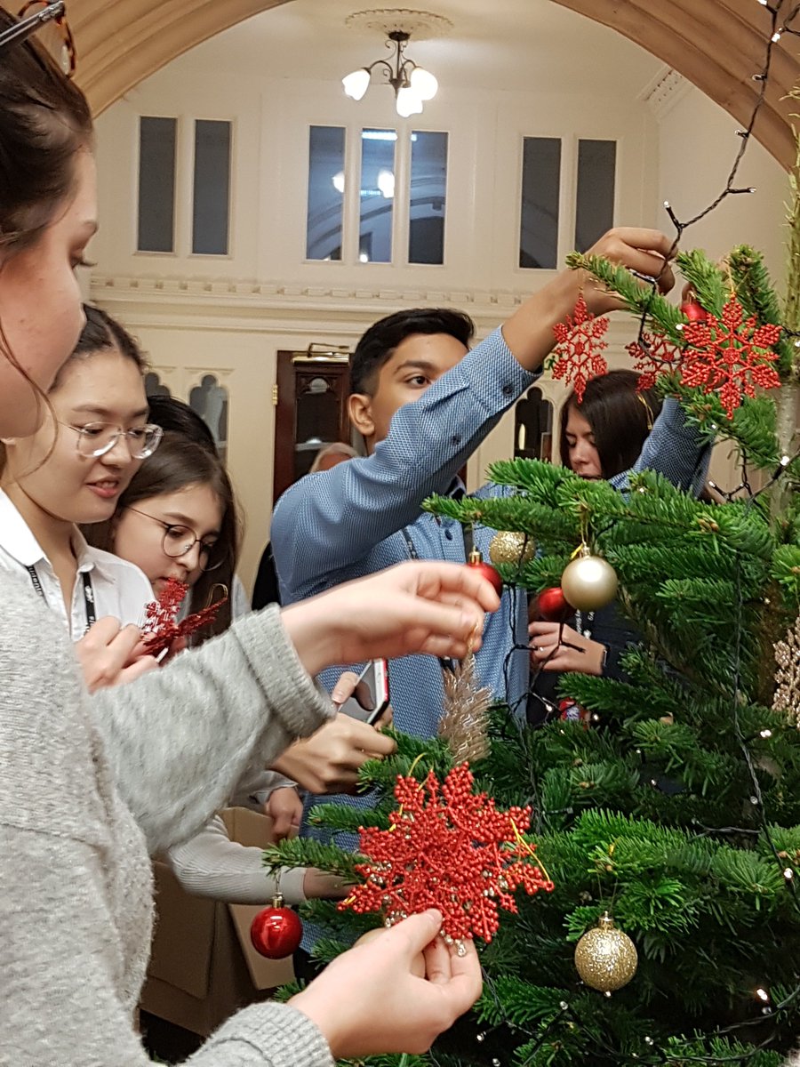 Getting into the Christmas spirit at <a href="/CATSEducationUK/">CATS Education</a> Canterbury - boarders decorating the #ChristmasTree #iloveboarding