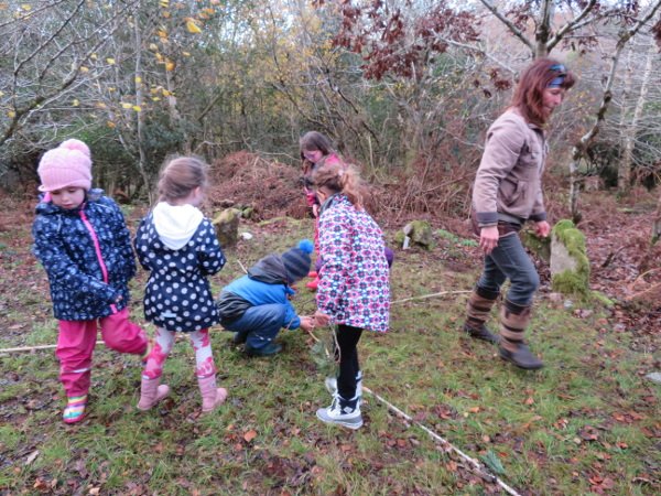 Clearing the site of leaves at Forest School, exploring with compass and binoculars. Learning about the 4 directions and seasons. Laying out the four directions. Well done. Time for free play! Next forest school is 15 December, we'll have a campfire.