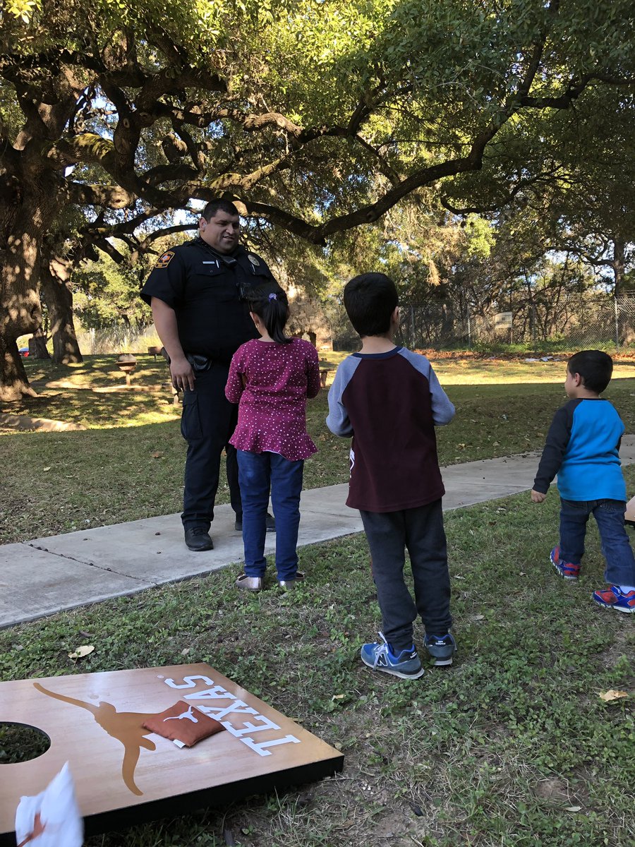 UTAustinPolice's tweet photo. Holiday treats with police! Happening now for University Apartments residents. #OrangeSanta https://t.co/qrA5dwMoTD