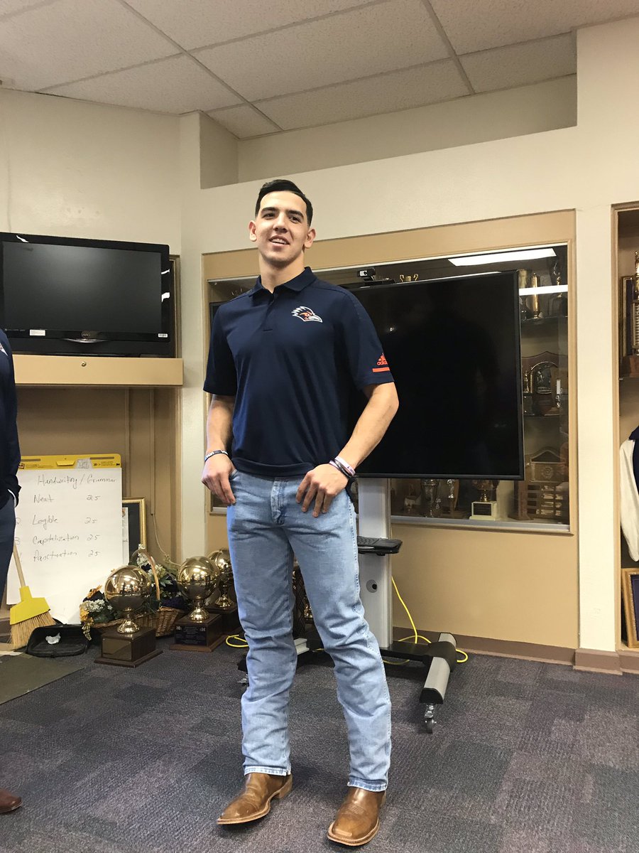 polo shirt and cowboy boots