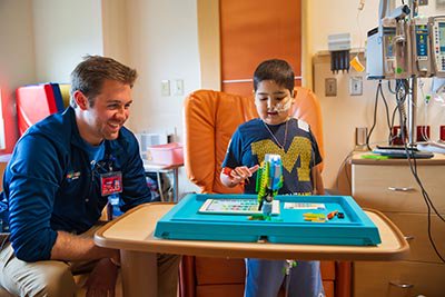 MottChildren's tweet photo. How @MottChildren's  ‘Lego Guy’ is making spirits bright for #LittleVictors through one of the most timeless toys: https://t.co/sVrBra0Fv6 https://t.co/pdv011JBk5