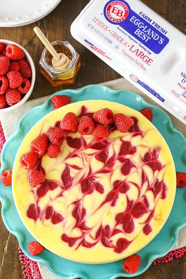 #AD Raspberry Goat Cheese Cheesecake! A smooth and creamy goat cheese cheesecake (made with <a href="/EgglandsBest/">Eggland's Best</a> eggs!) with a delicious raspberry swirl and a hint of honey in the crust! #OnlyEB #MadeWithEB #recipe #baking #cheesecake #christmas #dessert lifeloveandsugar.com/2018/12/19/ras…