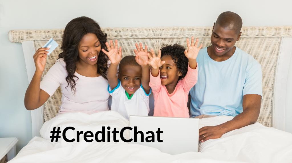 African American family cheering while using a laptop