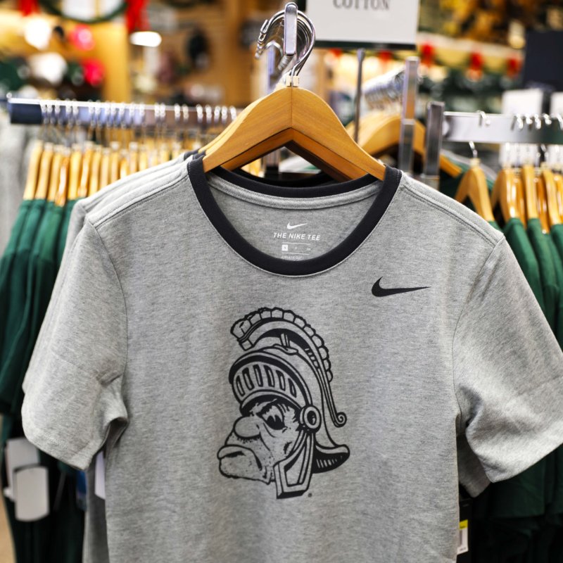 sbsmsu's tweet photo. #TBT Check out this week's featured throwback look! This gray t-shirt with the old Spartan logo is the perfect addition to your holiday wish list. Stop in and check it out! https://t.co/WXFjGTJypc
