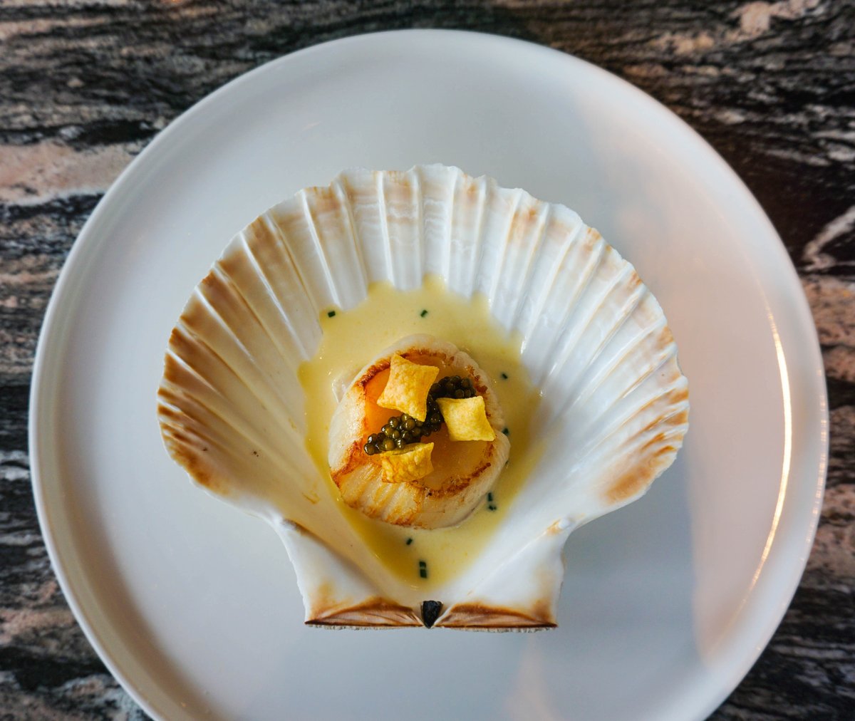 One of our classic and most loved dishes: XL Orkney scallop, Ivy House farm beurre blanc, Oscietra caviar.  See our other classic dishes and our festive menus here: langhamhotels.com/en/the-langham… #MondayMotivation #FrenchFood