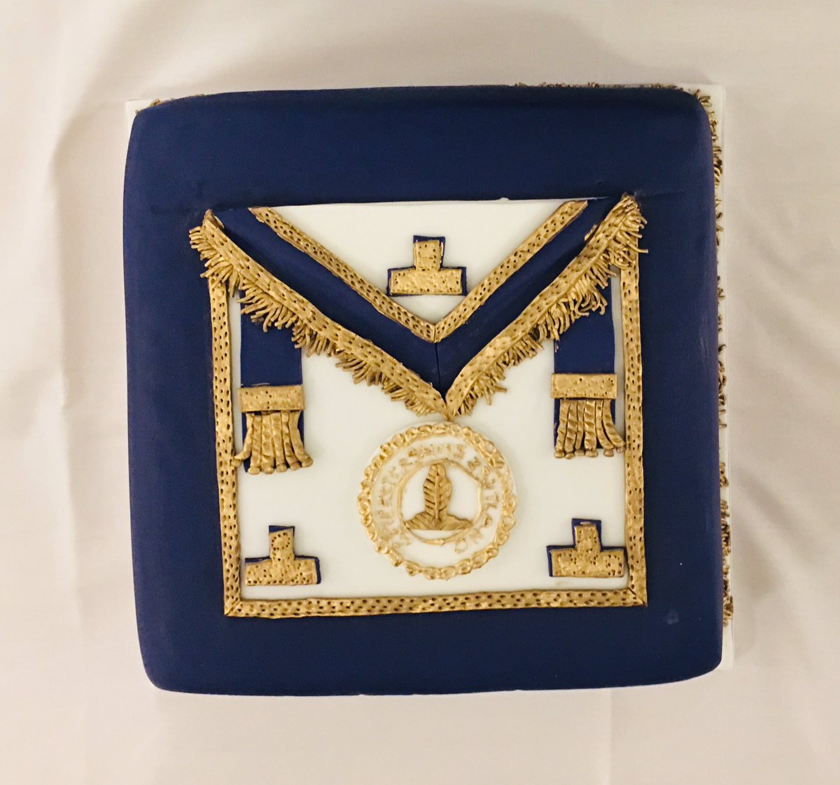 HighcrossLodge's tweet photo. W.Bro Derek Tranter PPSGW cutting his 90th Birthday cake at Highcross Lodge No.4835 on Thursday 6th December 2018. The Provincial Grand Master R.W.Bro David Hager &amp; W.Bro Anthony Webb accompany him. The cake included a fantastic design of a Provincial Apron. @LeicsFreemasons https://t.co/z46f3Lp1Ci