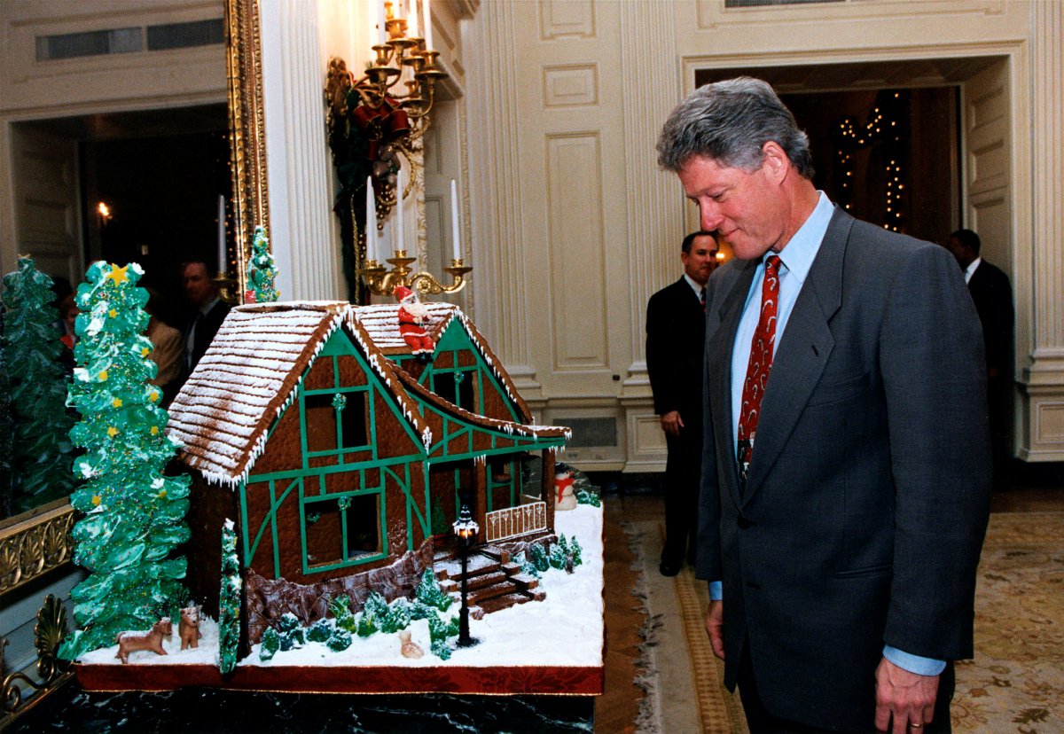 President Bill Clinton admires a gingerbread house in the State Dining ...