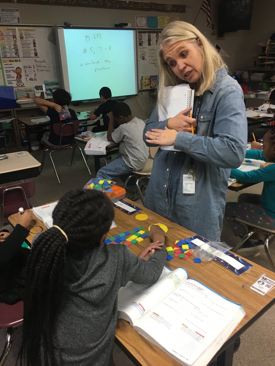 Our fabulous math coach, Mrs. Dickmeyer, uses manipulatives to help a student see that she has the correct answer. #opsproud