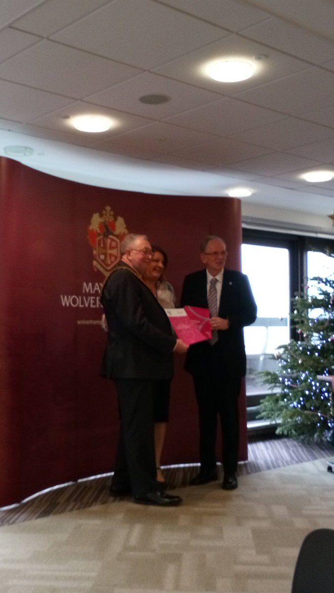 Collecting Housing Assistance certificate for participation in the Dementia Action Alliance from the Mayor