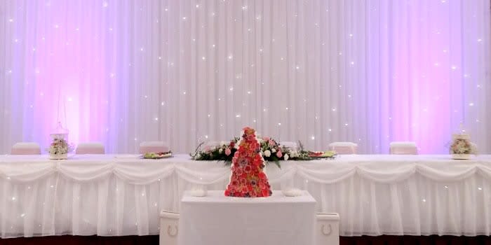 Our Starlight backdrop range are now available in both white twinkle light or warm white twinkle.
Add the top table starlight skirts to compliment the backdrop.
