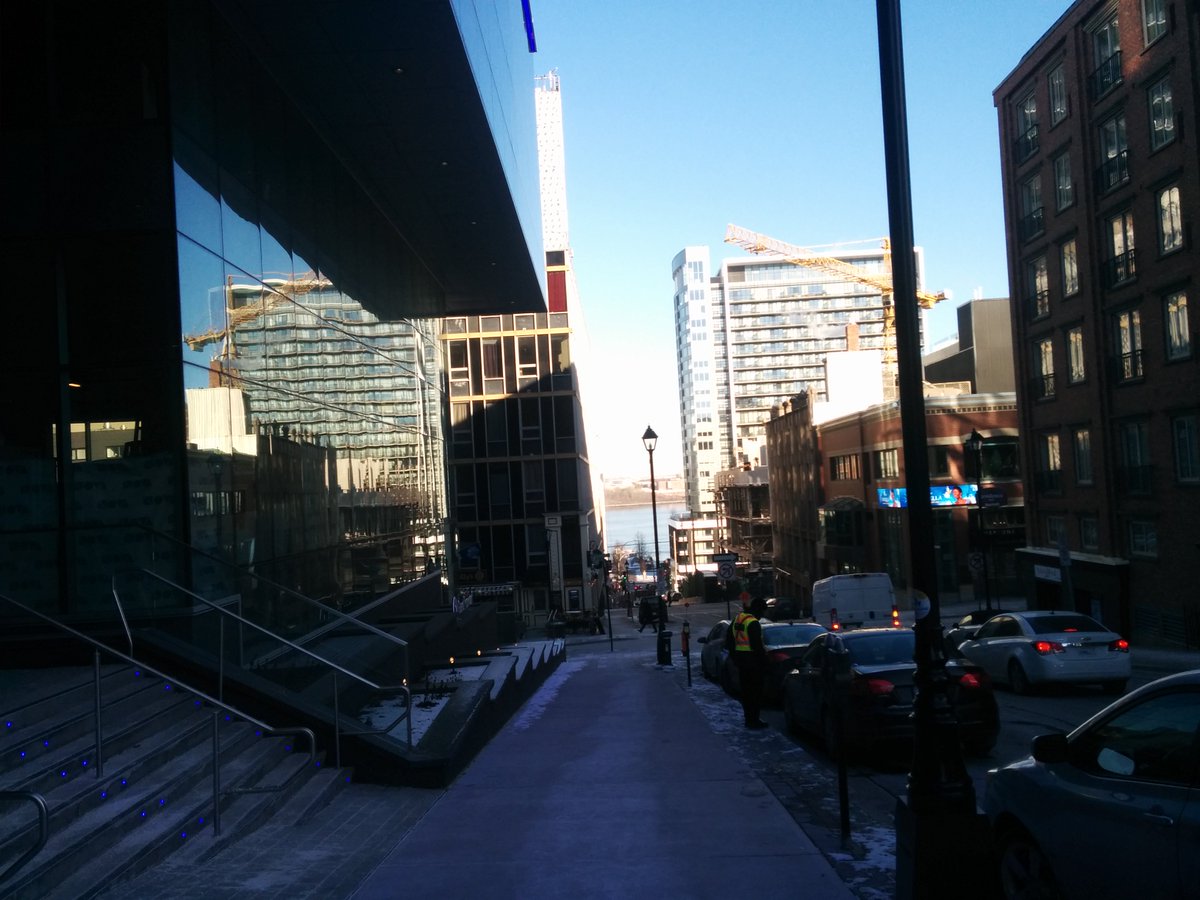 foss4ghfx's tweet image. Photo taken yesterday with Nova Centre on left, looking down towards the Halifax harbour (where the gala waterfront dinner will be), on a beautiful sunny yet cold winter afternoon.  Keep your #foss4g fingers crossed today team!